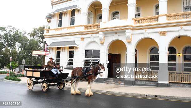 Seen is a man riding in a horse drawn carriage along the streets on July 09, 2017 in Rockhampton, Australia