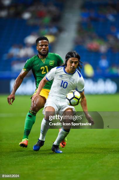 El Salvador midfielder Gerson Mayen gets control of the ball in front of Jamaica defender Jermaine Taylor during the CONCACAF Gold Cup soccer match...