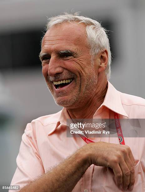 Red Bull Racing Chairman Dietrich Mateschitz laughs in the paddock prior to the French Formula One Grand Prix at the Circuit de Nevers Magny-Cours on...