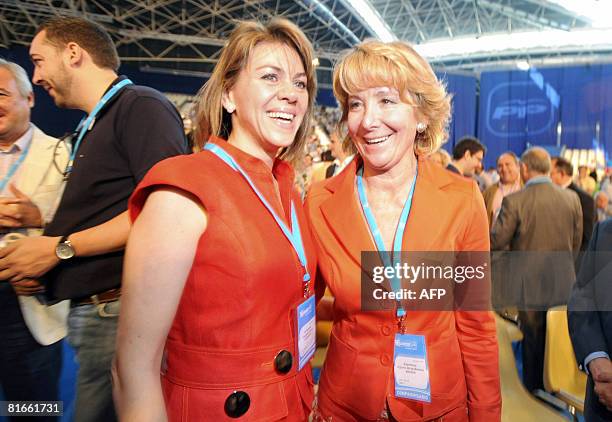 Spain's Popular Party new general secretary, Maria Dolores de Cospedal , smiles with Esperanza Aguirre , the head of the Madrid capture of the party,...