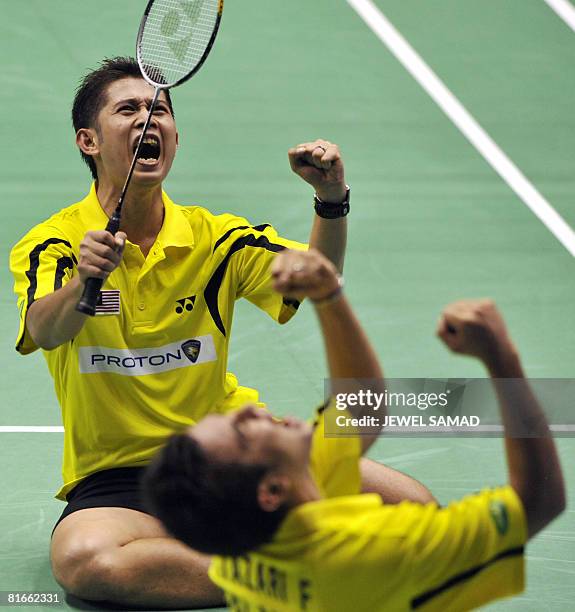 Zakry Abdul Latif and Fairuzizuan Mohammd Tazari of Malaysia celebrate defeating Tony Gunawan of the US and Candra Wijaya of Indonesia during their...