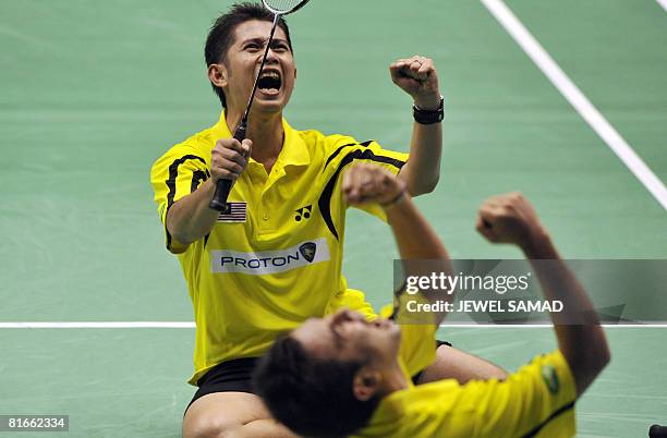 Zakry Abdul Latif and Fairuzizuan Mohammd Tazari of Malaysia celebrate defeating Tony Gunawan of the US and Candra Wijaya of Indonesia during their...