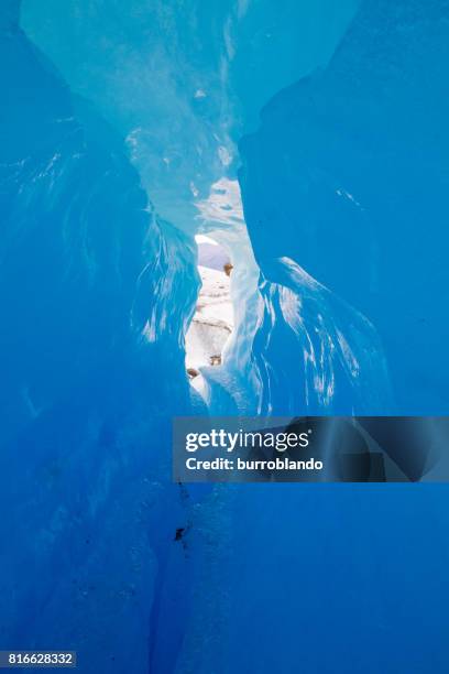 a large crack inside an ice cave on perito moreno glacier argentina - icecap stock pictures, royalty-free photos & images