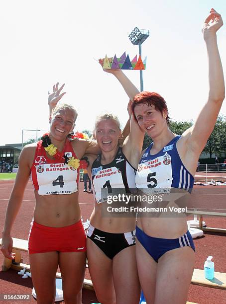 Jennifer Oeser, Lilli Schwarzkopf and Sonja Kesselschlaeger of Germany celebrates after qualified for the Olympic Games Beijing 2008 during the...