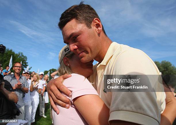 Martin Kaymer of Germany hugs his girlfriend Jenny as he bursts into tears after winning The BMW International Open Golf at The Munich North...