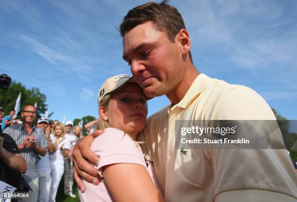 Martin Kaymer of Germany hugs his girlfriend Jenny as he bursts into tears after winning The BMW International Open Golf at The Munich North...