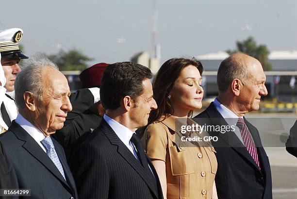 In this handout image supplied by the Israeli Govermnt Press Office , Israeli President Shimon Peres, French President Nicolas Sarkozy, his wife...