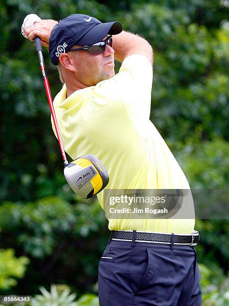 Stewart Cink watches the flight of his tee shot during the final round of the Travelers Championship at TPC River Highlands held on June 22, 2008 in...