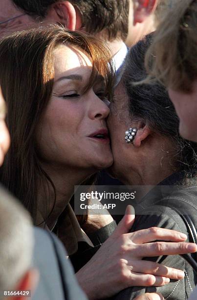 French First Lady Carla Bruni-Sarkozy kisses French philosopher and Holocaust survivor Simone Weil during a welcoming ceremony for French President...
