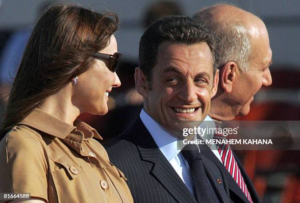 French First Lady Carla Bruni-Sarkozy , French President Nicolas Sarkozy and Israeli Prime Minister Ehud Olmert attend a welcoming ceremony on June...
