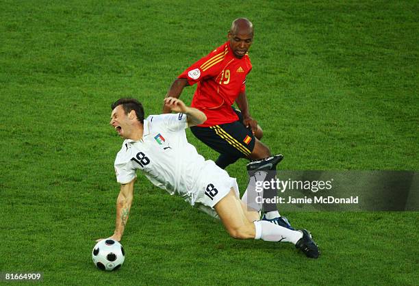 Antonio Cassano of Italy is tackled and fouled by Marcos Senna of Spain during the UEFA EURO 2008 Quarter Final match between Spain and Italy at...