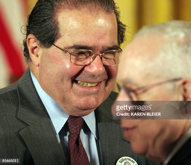 Supreme Court Justice Anton Scalia smiles after greeting US Attorney General Michael Mukasey before the Presidential Medal of Freedom Ceremonies on...