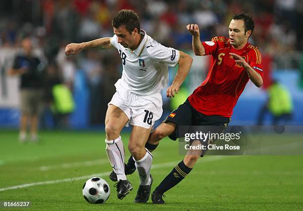 Antonio Cassano of Italy is challenged by Andres Iniesta of Spain during the UEFA EURO 2008 Quarter Final match between Spain and Italy at Ernst...