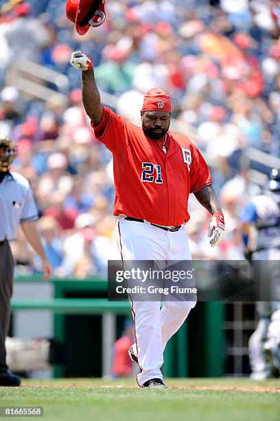 Dmitri Young of the Washington Nationals throws his helmet after striking out against the Texas Rangers at Nationals Park June 22, 2008 in...