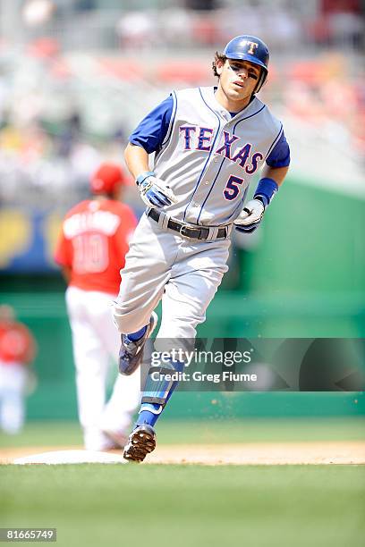 Ian Kinsler of the Texas Rangers rounds the bases after hitting a home run in the sixth inning against the Washington Nationals at Nationals Park...