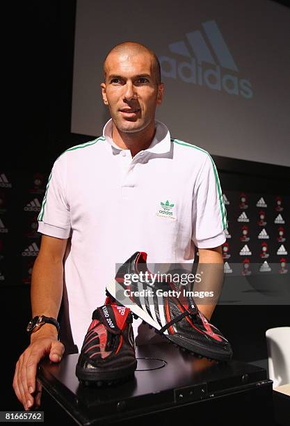 Former international footballer Zinedine Zidane poses with shoes during a press conference during UEFA EURO 2008 on June 22, 2008 in Vienna, Austria.