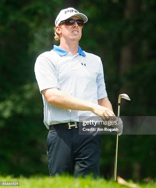 Hunter Mahan watches the flight of his ball during the final round of the Travelers Championship at TPC River Highlands held on June 22, 2008 in...