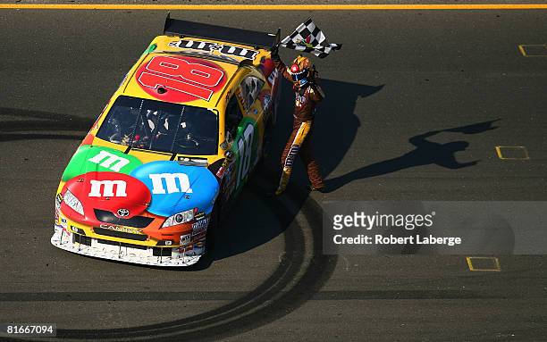 Kyle Busch driver of the M&M'S Toyota celebrates after winning during the NASCAR Sprint Cup Series Toyota/Save Mart 350 at the Infineon Raceway on...