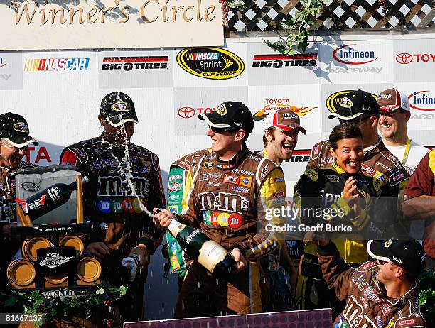 Kyle Busch, driver of the M&M's Toyota, celebrates after winning the NASCAR Sprint Cup Series Toyota/Save Mart 350 at the Infineon Raceway on June...