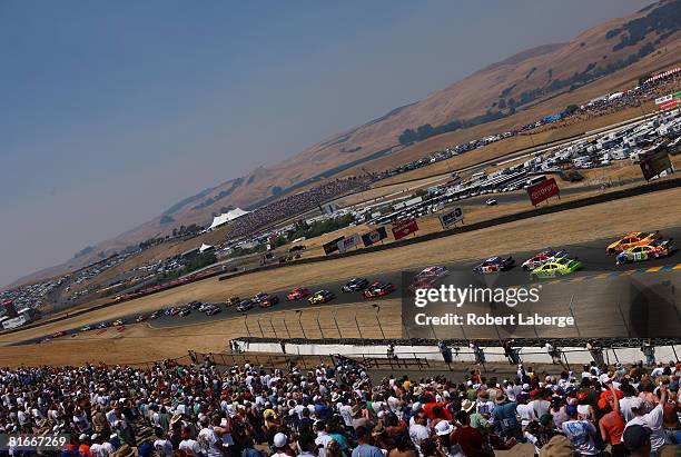 Kasey Kahne driver of the Budweiser Dodge leads the field at the start of the NASCAR Sprint Cup Series Toyota/Save Mart 350 at the Infineon Raceway...