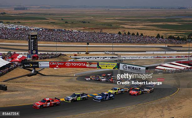 Kasey Kahne driver of the Budweiser Dodge leads the field at the start of the NASCAR Sprint Cup Series Toyota/Save Mart 350 at the Infineon Raceway...