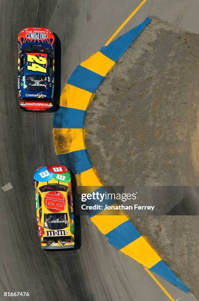 Jeff Gordon in his DuPont Chevrolet leads Kyle Busch in his M&M's Toyota during the NASCAR Sprint Cup Series Toyota/Save Mart 350 at the Infineon...