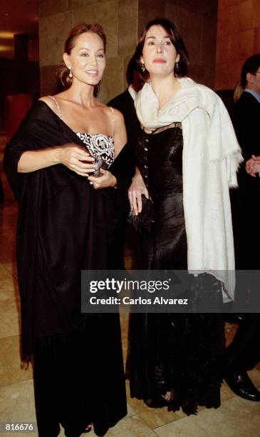 Former wife of singer Julio Iglesias, Isabel Preysler, left, and Carmen Rossi, Franco's granddaughter, attend the presentation of Giorgio Armani's...