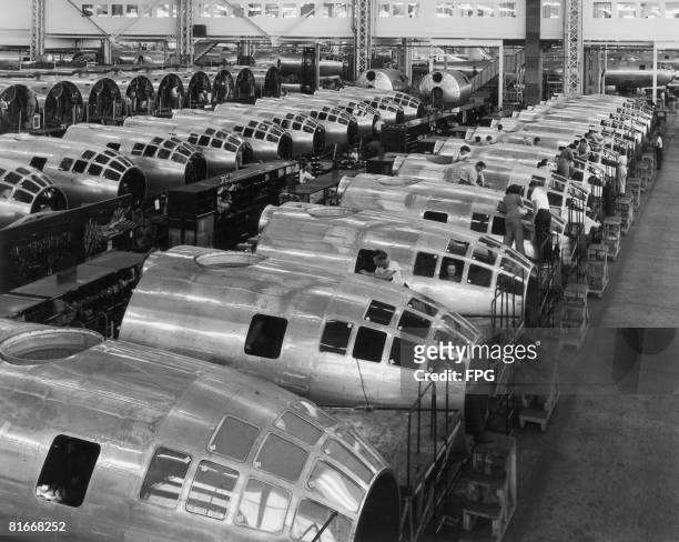 The nose sections of American B.29 Superfortress bombers under construction at the Boeing plant in Wichita, Kansas, October 1944. The aircraft were...
