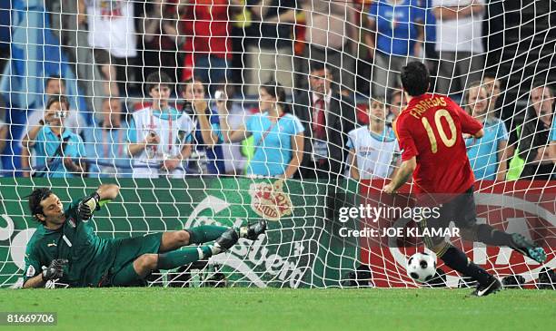 Spanish midfielder Cesc Fabregas scores the last goal on penalty against Italian goalkeeper Gianluigi Buffon during the Euro 2008 Championships...