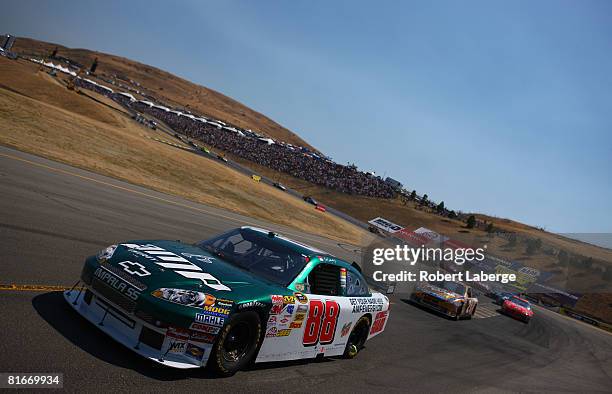 Dale Earnhardt Jr. Driver of the National Guard AMP Energy Chevrolet leads a pack of cars during the NASCAR Sprint Cup Series Toyota/Save Mart 350 at...