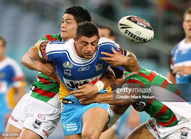 Mark Minichiello of the Titans loses the ball in the tackle during the round 15 NRL match between the South Sydney Rabbitohs and the Gold Coast...