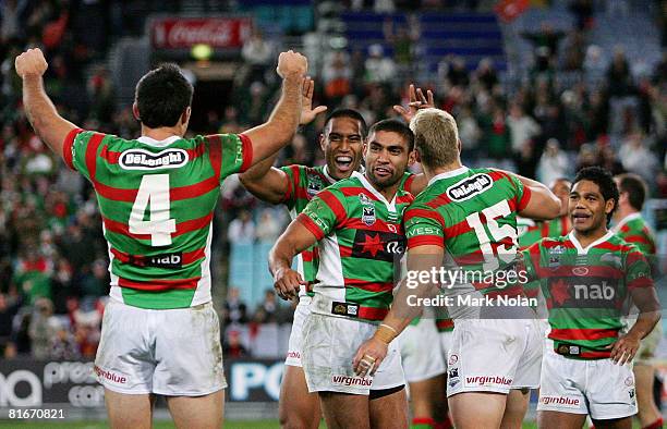 Nathan Merrit of the Rabbitohs celebrates victory with team mates after the round 15 NRL match between the South Sydney Rabbitohs and the Gold Coast...