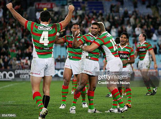 Nathan Merrit of the Rabbitohs celebrates victory with team mates after the round 15 NRL match between the South Sydney Rabbitohs and the Gold Coast...