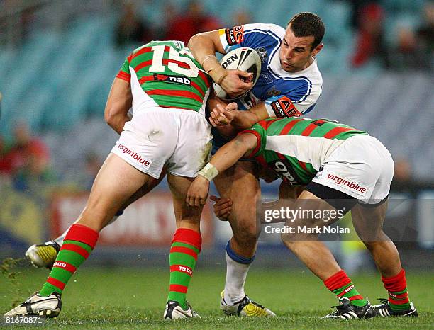 Anthony Laffranchi is tackled during the round 15 NRL match between the South Sydney Rabbitohs and the Gold Coast Titans at ANZ Stadium on June 23,...