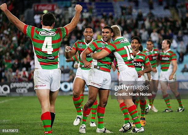 Nathan Merrit of the Rabbitohs celebrates victory with team mates after the round 15 NRL match between the South Sydney Rabbitohs and the Gold Coast...