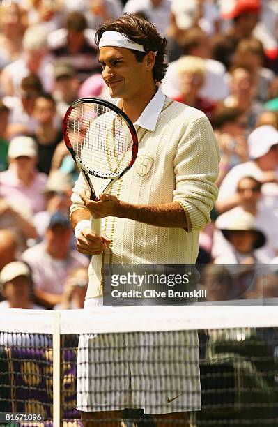 Roger Federer of Switzerland prapares for his men's singles round one match against Dominik Hrbaty of Slovakia on day one of the Wimbledon Lawn...