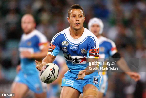 Scott Prince of the Titans passes the ball during the round 15 NRL match between the South Sydney Rabbitohs and the Gold Coast Titans at ANZ Stadium...