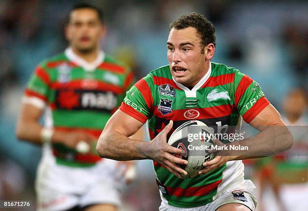 Ben Lowe of the Rabbitohs runs the ball during the round 15 NRL match between the South Sydney Rabbitohs and the Gold Coast Titans at ANZ Stadium on...