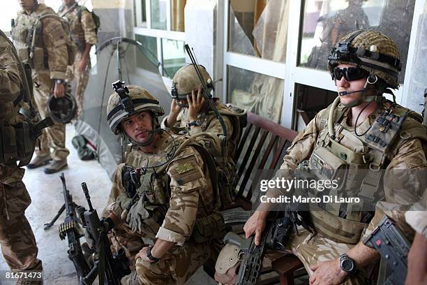 British paratrooper from 3rd Battalion The Parachute Regiment Cpl. Carl Tees from South Africa and Pvt. David Flynn from Coatbridge, Scotland, gatger...