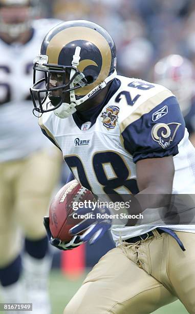 Marshall Faulk of the St. Louis Rams runs upfield against the Buffalo Bills Sunday, November 21, 2004 at Ralph Wilson Stadium in New York. Buffalo...