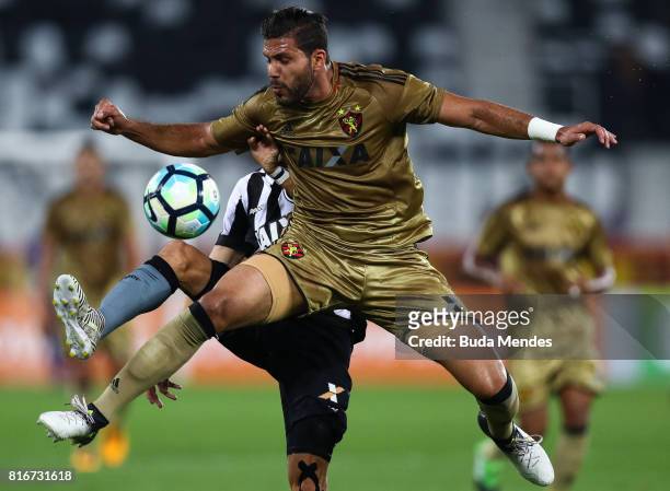 Rodrigo Pimpao of Botafogo struggles for the ball with Osvaldo Henriquez of Sport Recife during a match between Botafogo and Sport Recife as part of...
