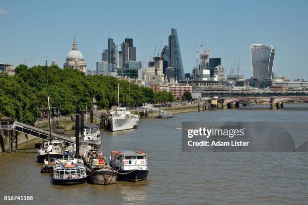 moored boats by the city - adam lister stock pictures, royalty-free photos & images