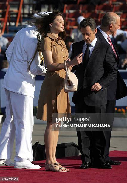 French First Lady Carla Bruni-Sarkozy , French President Nicolas Sarkozy and Israeli Prime Minister Ehud Olmert attend a welcoming ceremony on June...