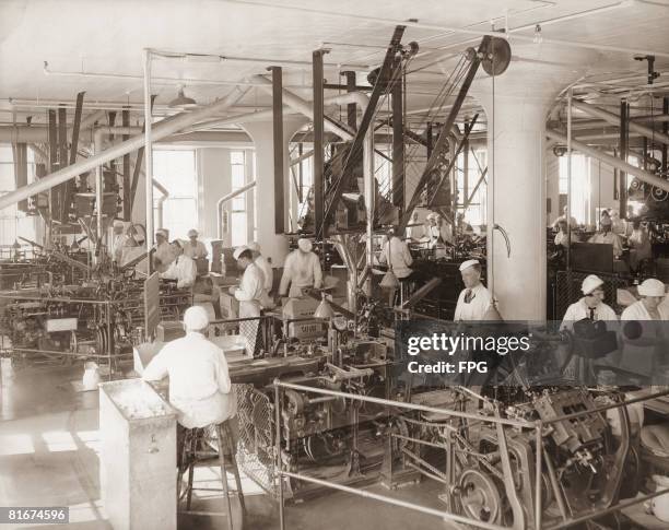 Weighing machine at the Salada tea factory makes sure that each packet of tea contains exactly the same amount, circa 1930.