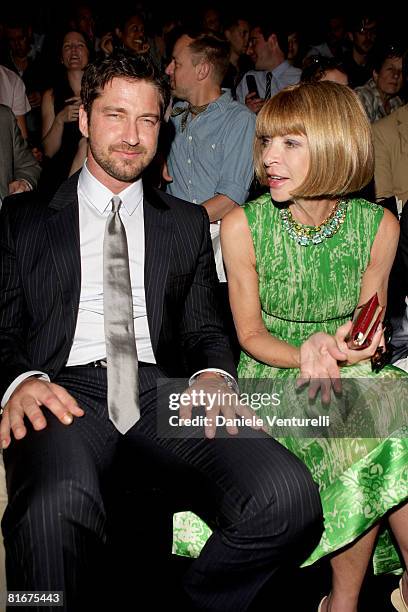 Actor Gerard Butler and Anna Wintour, editor-in-chief of American Vogue, attend Dolce & Gabbana fashion show as part of Milan Fashion Week...