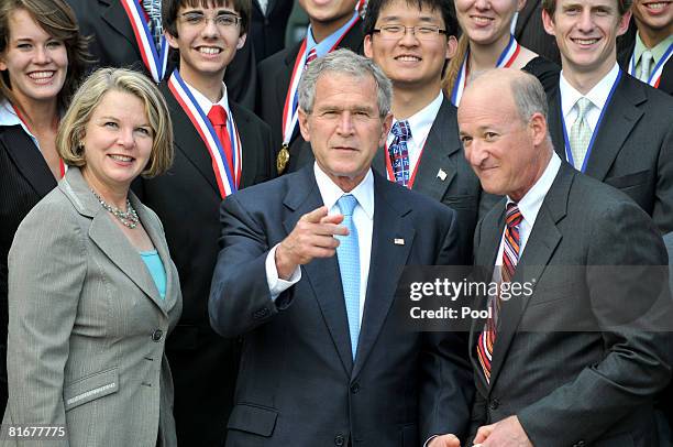 United States President George W. Bush points to towards the photographers during a photo opportunity with the 2008 Presidential Scholars at the...