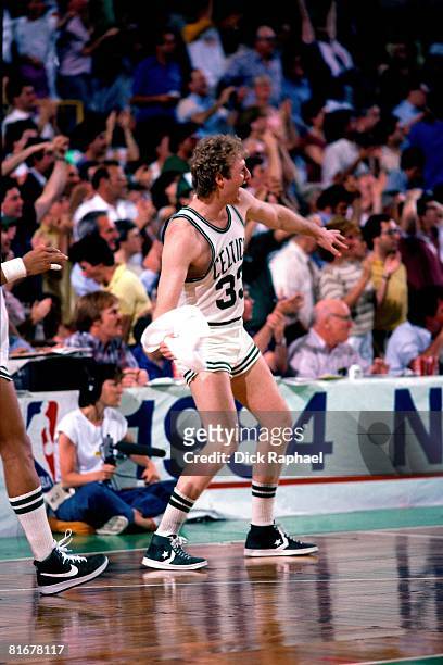 Larry Bird of the Boston Celtics celebrates during a game circa 1984 at the Boston Garden in Boston, Massachusetts. NOTE TO USER: User expressly...