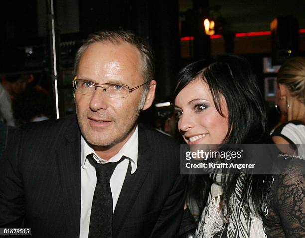 Moderator Reinhold Beckmann and Singer Stefanie Kloss from the band Silbermond attend during the Platin and Triple-Gold Award at the 'Bank' on June...