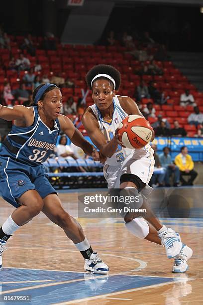 Dominique Canty of the Chicago Sky moves the ball against Nikki Blue of the Washington Mystics during the game on June 13, 2008 at the UIC Pavilion...