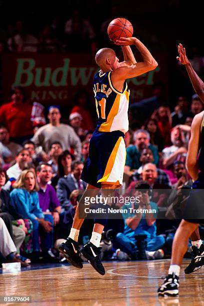Reggie Miller of the Indiana Pacers shoots a three-pointer in Game One of the Eastern Conference Semifinals against the New York Knicks during the...